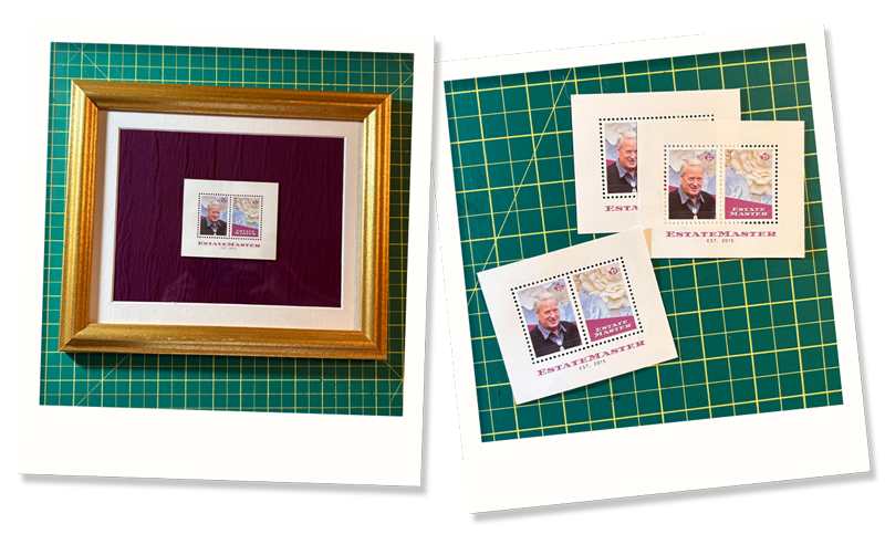 A framed commemorative stamp featuring a portrait and two additional unframed stamps with similar designs placed on a green cutting mat.